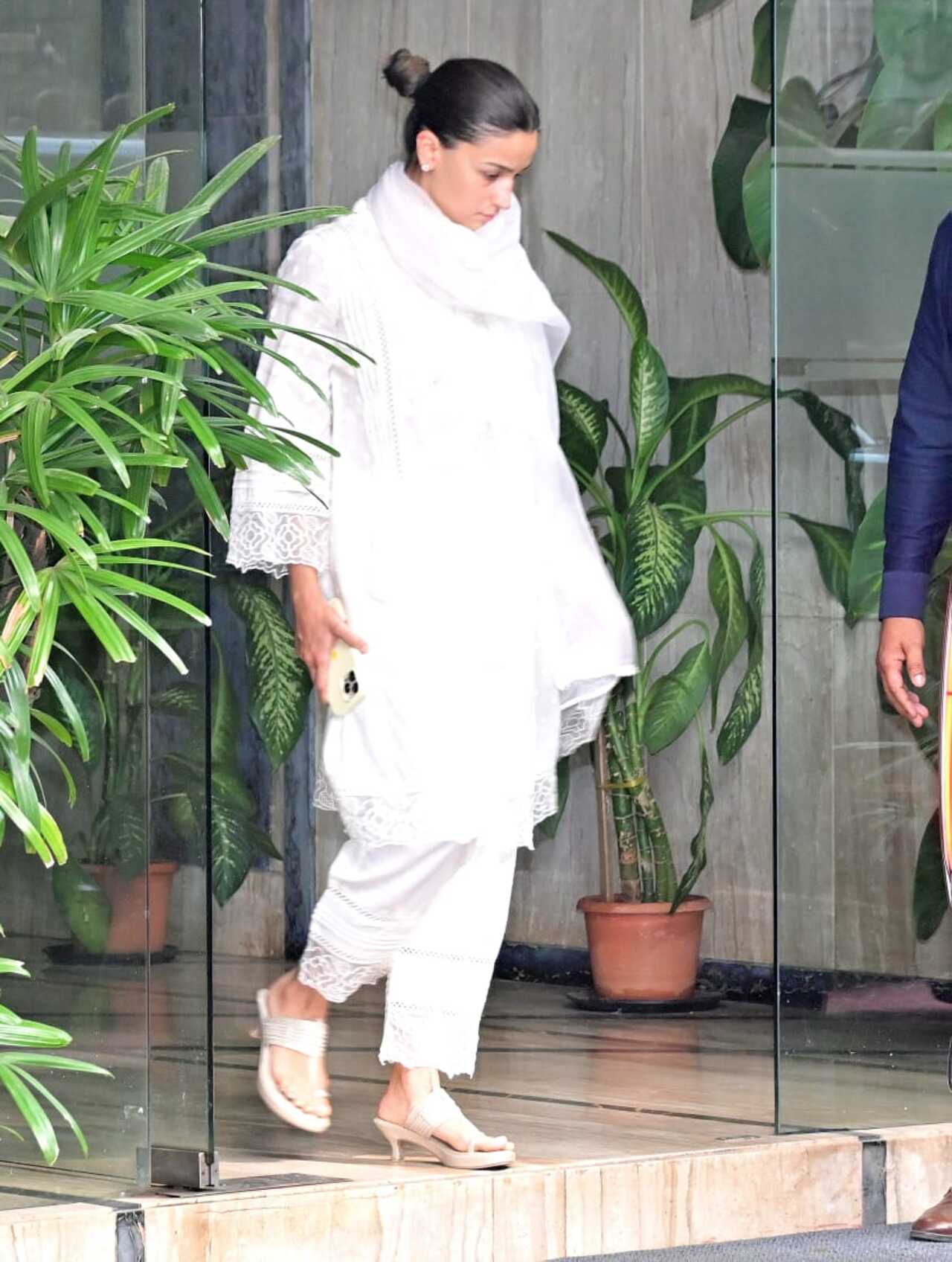 Alia Bhatt was seen stepping out ahead of Ranbir Kapoor, wearing a chic white suit set and opting for a no-makeup look.